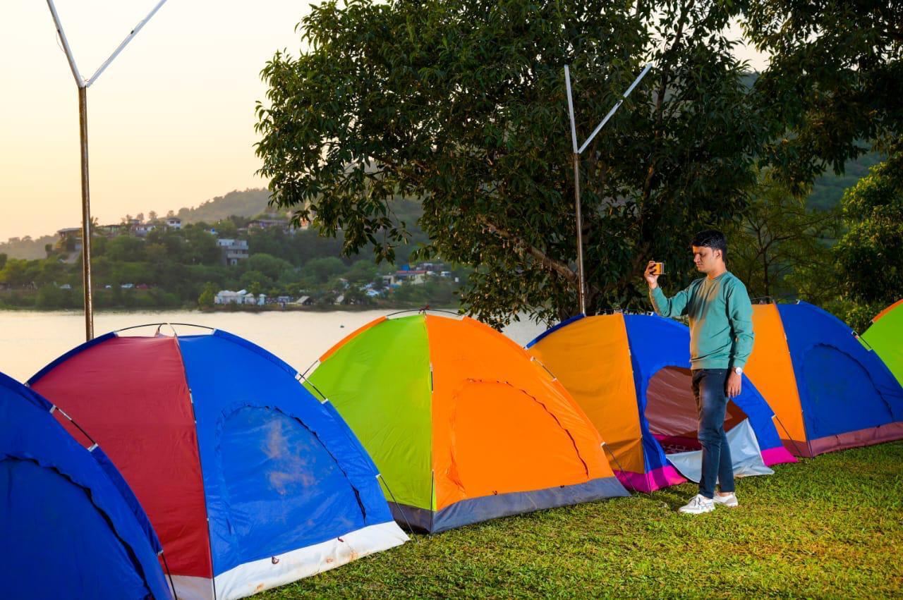 Colourful tents on the lawn at Chillout Pawana