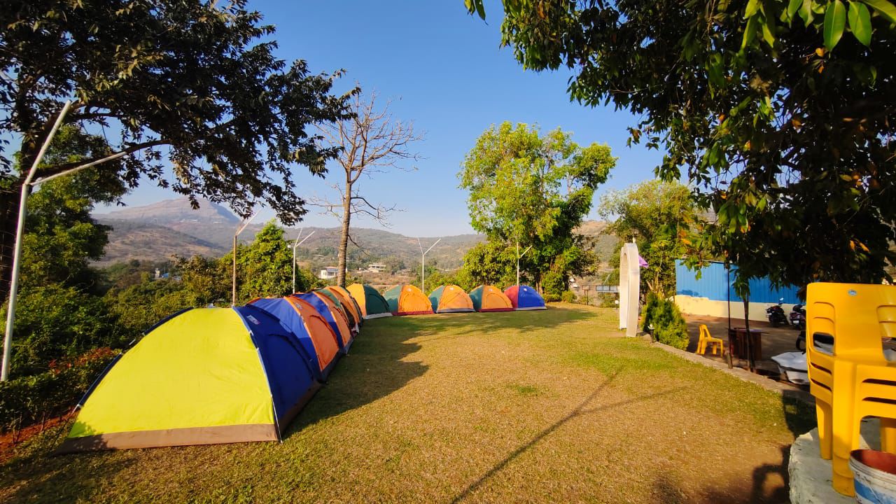 Side view of the tent row with hills behind