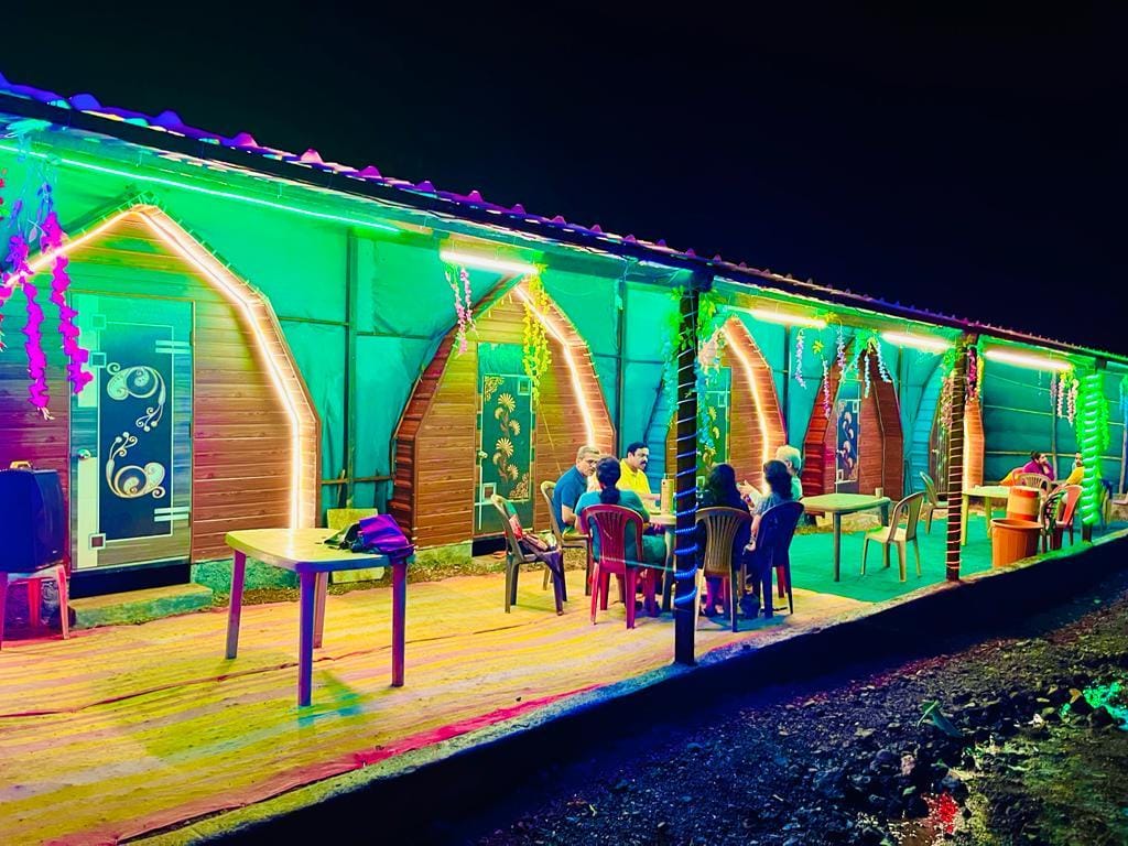Pawna Machi cottages lit up at night