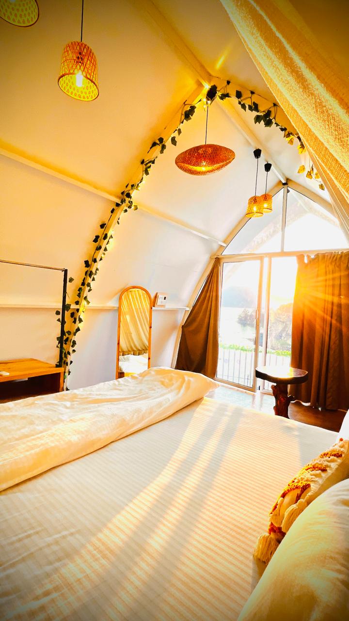 Petal Homes cottage bedroom with lake view at sunset