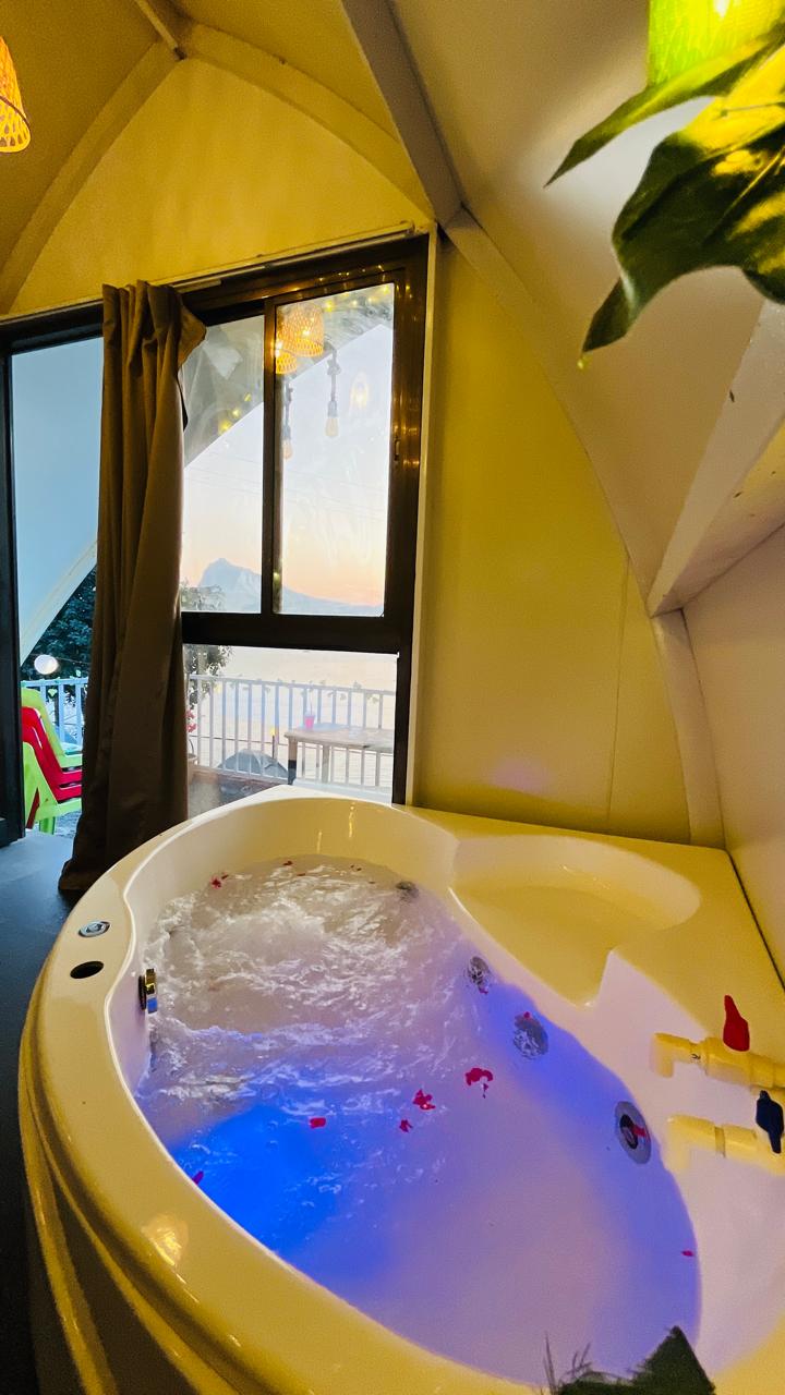 Private jacuzzi with lake view at Petal Homes