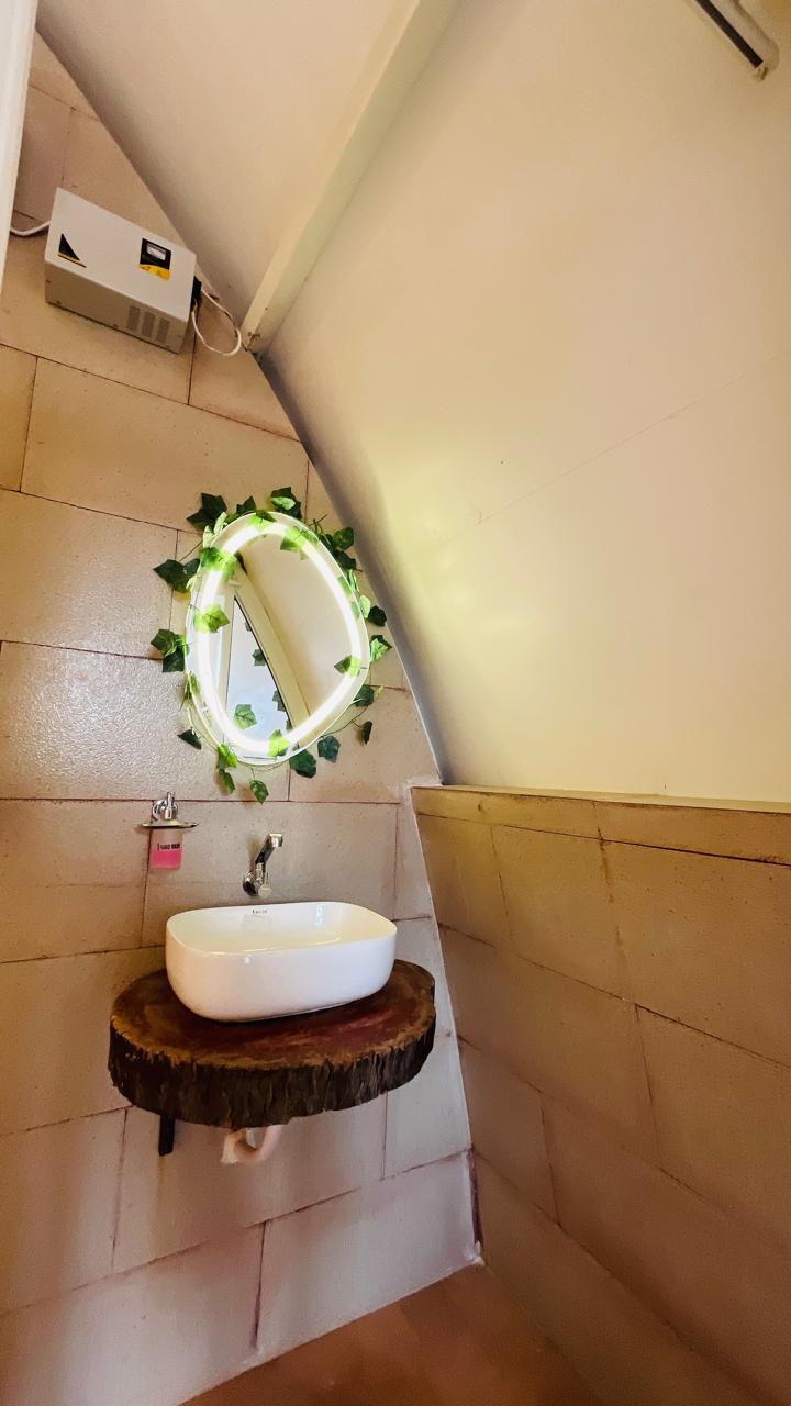 Washroom basin with round LED mirror